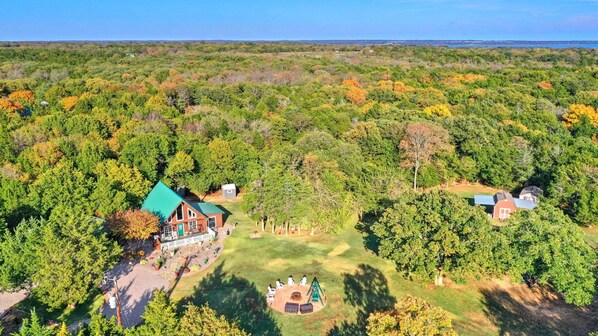 15 acres of wildlife and woods with a creek make this ranch a perfect getaway. 