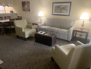 Your spacious living room has a pull out couch, TV and electric fireplace