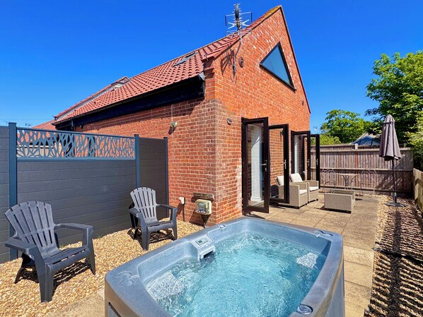 South facing private patio with hot tub