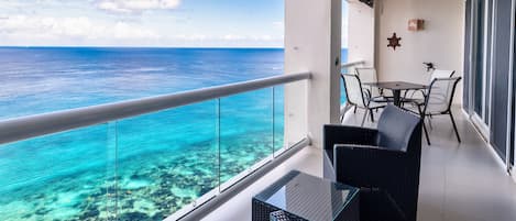 Relax on your private balcony overlooking the pool, beach and ocean.