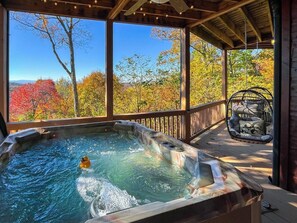 Serene hot tub perched on the deck with breathtaking mountain views.