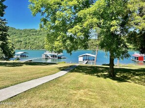 Back yard gently sloping to water.  Very accessible for all abilities and ages.