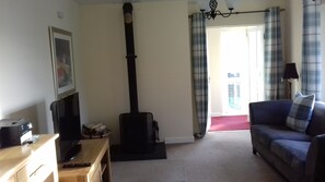 Lounge with log burner.