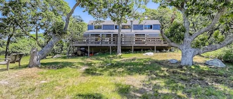 The back of the house that faces the water.