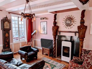 sitting room with pellet stove and the men in black.