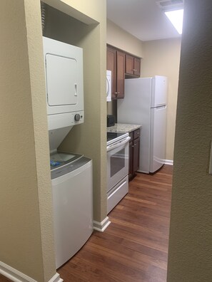 A glimpse of your washer/dryer and kitchen.