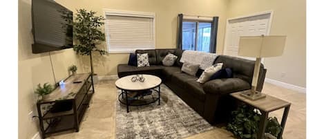 Spacious and welcoming living room with comfortable seating for relaxation!