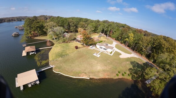 Large 1 Acre Lot w privacy. 2 slip boat dock and swimming tan deck.  Deep water.