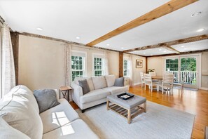 2nd Floor living room with gas fireplace.  Flows into kitchen/dining area.  