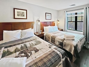 The 2nd bedroom has two Queen beds and more amazing mountain views