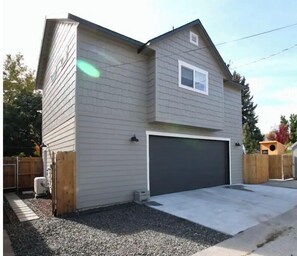 View from alley way to the side entrance of the house.