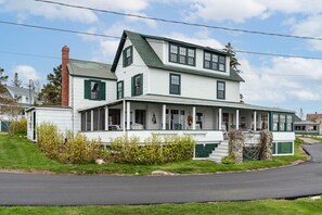 Front view of the house, parking at each side of the house
