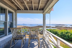 Relax with breathtaking views on the West Porch which lead you to the main entryway of the Cottage