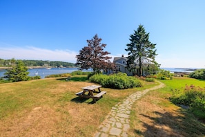 Easily access the Bunkhouse, Annex, and outdoor amenities on a stone path from the Cottage