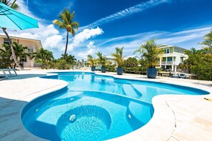 Enjoy a refreshing swim in the pool with a picturesque canal view at Bristol Keys.