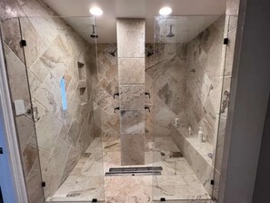 "Luxury travertine group shower with 4 showerheads"