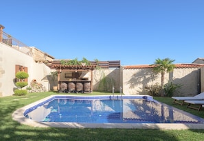 The secluded enclosed garden and large outdoor pool