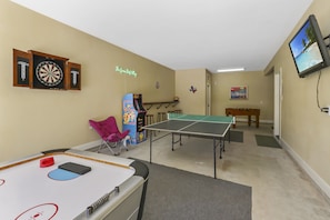 Garage gameroom with Air Hockey, Ping Pong, Foosball and video games!