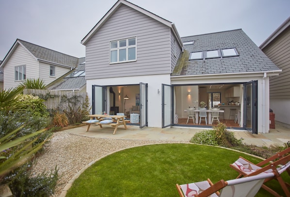5 The Sands, Polzeath. The sitting/living area opening up into the beautiful back garden