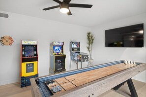 Play a competitive game of shuffleboard! 