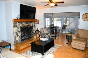 View from hallway to livingroom and lakeside windows