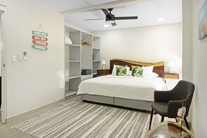 Master bedroom with a king size bed, ensuite bathroom and ample closet space. Choose between air conditioning or ceiling fan for a more natural breeze.