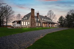 A majestic estate offering grand views of a 107 acre horse farm.