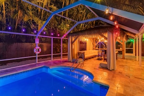 Fully screened and heated outdoor saltwater pool 14'x28' and tiki-style gazebo