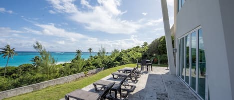 Patio with 180-degree beach and ocean views spread out in front of you.