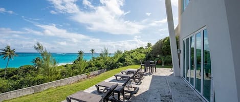 Patio with 180-degree beach and ocean views spread out in front of you.