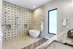 Master bath with large shower and soaking tub.