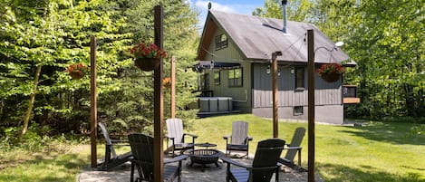 Jump from the hot tub to the fire pit at your Vermont Chalet. 