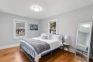 King Bed - First floor primary bedroom, comfortable mattress, bedside chargers