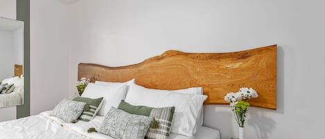 King size bed with custom 8-foot white oak headboard