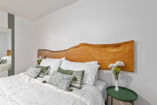 King size bed with custom 8-foot white oak headboard