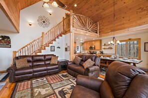 Open Floor Plan with Leather Furniture and Vaulted Ceilings