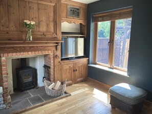 Cosy sitting room with log burner. 32" TV with apple TV, Netflix & Amazon prime.