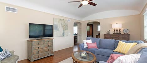 Cozy living room with gas fireplace and TV