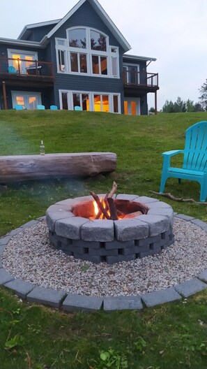 Fire pit that faces the lake, a very peaceful setting.