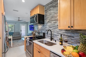 Create great memories with family and friends while on vacation! The open concept of our lovely dining area and modern fully equipped kitchen.  If you like this minimalist setup, don't hesitate to send us a message now!