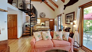View back to kitchen area from living room.  Spiral staircase on the left