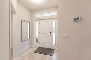 front door from the inside with touch screen thermostat 