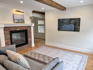 Living room with double sided gas fireplace