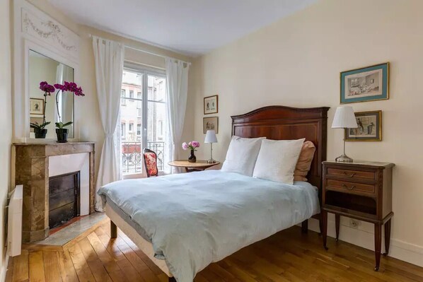 You'll have sweet dreams in this lovely sunlit room.