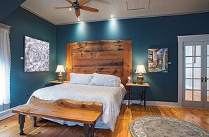 Adjustable king bed with barnwood headboard, artist-built hemlock bench