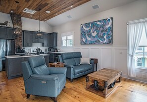 Living Room with leather power-reclining furniture.