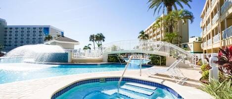 Hot tub by pool.