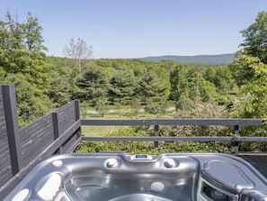 Enjoy the hot tub, situated atop of the outdoor deck off of the house overlooking panoramic mountain views.