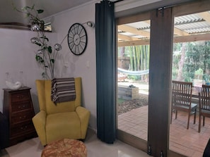 Exit from living area to outdoor undercover veranda facing the creek.