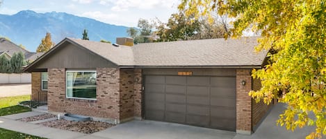 House front view, 2 car garage and outside parking